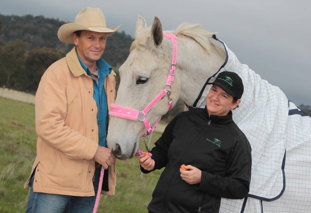 GAME ON: Farrier Brett Wilms, Jag the horse and Sally Formosa are raising money for Riding for the Disabled. Picture: Les Smith