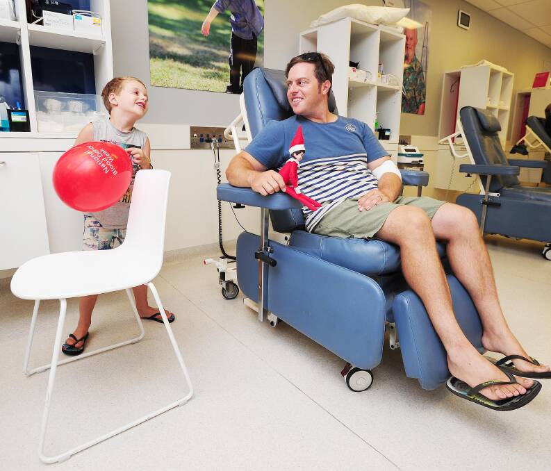 KOBI'S KLUB: Kobi McDonald and dad Nigel McDonald have fun while Mr McDonald makes his final donation at the Wagga Donor Centre before the family moves. Picture: Kieren L Tilly