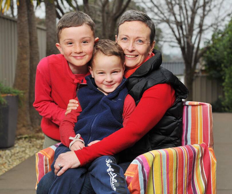 HEART TO HEART: Fiona Culley with children James, 8, and Hugh, 4, ahead of The Bald and the Beautiful red and pink spring cocktail party. Picture: Kieren L Tilly