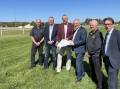 Murrumbidgee Turf Club (MTC) vice president Kevin Cross, treasurer Brett Bradley, president Geoff Harrison, minister for racing David Harris, MTC chief executive Jason Ferrario and member for Wagga Dr Joe McGirr inspect the site of the proposed stable complex on Tuesday. Picture by Matt Malone