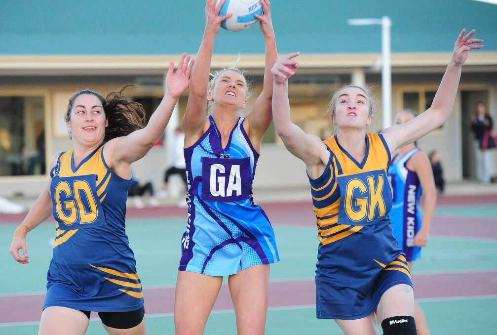 STRONG: New Kids Aces' Mikaela Cole takes the ball in front of Turvey Park's Jaimee Smith and Della Winnel last month. Both teams have big games this Saturday. Picture: Kieren L Tilly