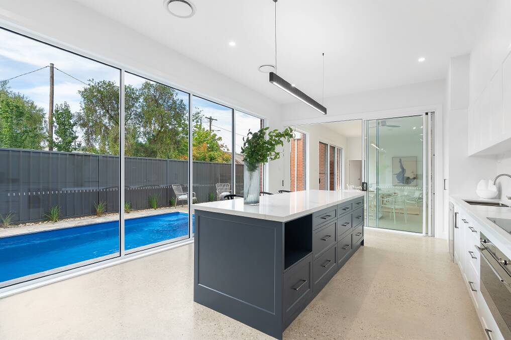 The open-plan design seamlessly blends the living, kitchen, and dining areas, which all overlook a charming plunge pool and yard, creating a perfect setting for relaxation and entertainment. Picture supplied.