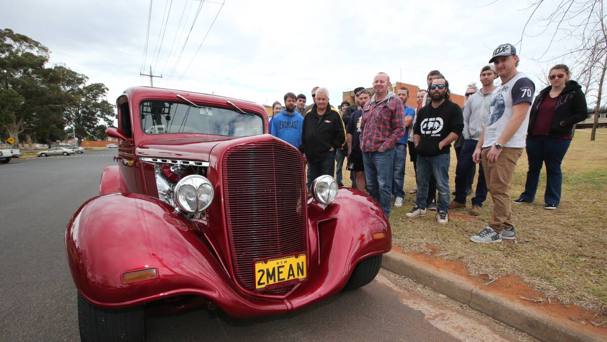 DRIVING FORCE: Motoring enthusiasts gather behind Griffith's main street to show their support for a burnout pad in the city.