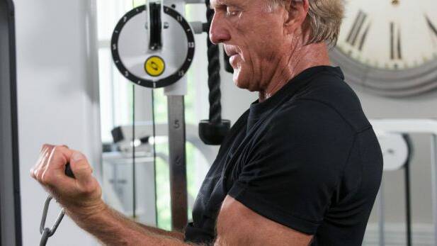 Greg Norman works out everyday. His sessions include three sets of cable bicep curls, 12 reps each.  Photo: Michael O'Bryon
