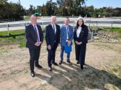 Wagga mayor Dallas Tout, Member for Riverina Michael McCormack, Wagga City Council's director of strategy and projects Phil McMurray and Senator Deborah O'Neill at the Holbrook Road and Dunns Road intersection. Picture by Les Smith 