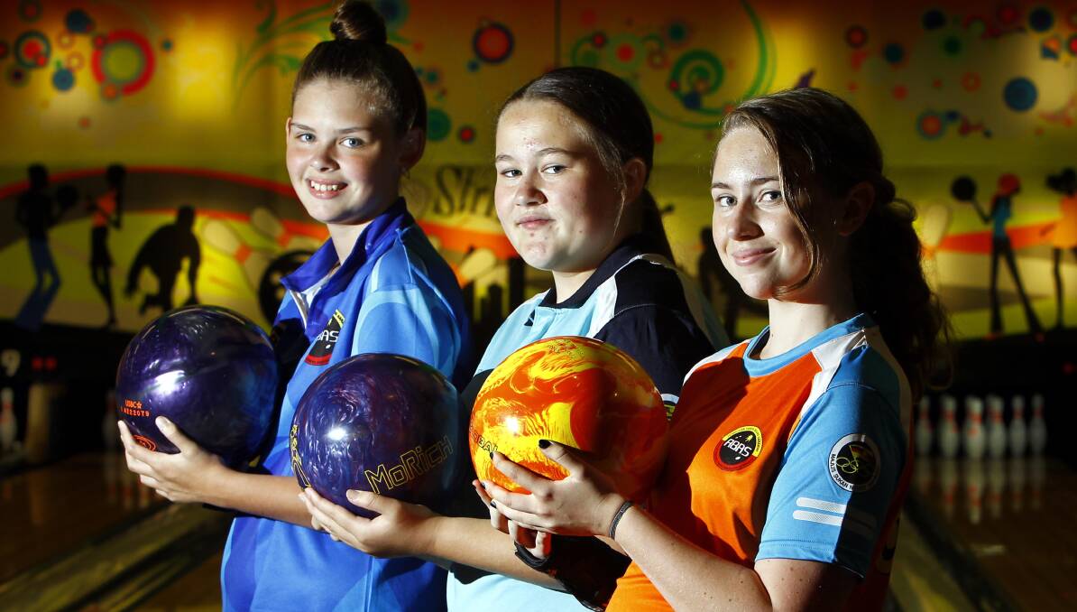 BOUND FOR NATIONALS: Wagga tenpin bowlers (from left) Natarsha O'Leary, 14, Emma Scott, 15, and Lily Crocker, 15. Picture: Les Smith