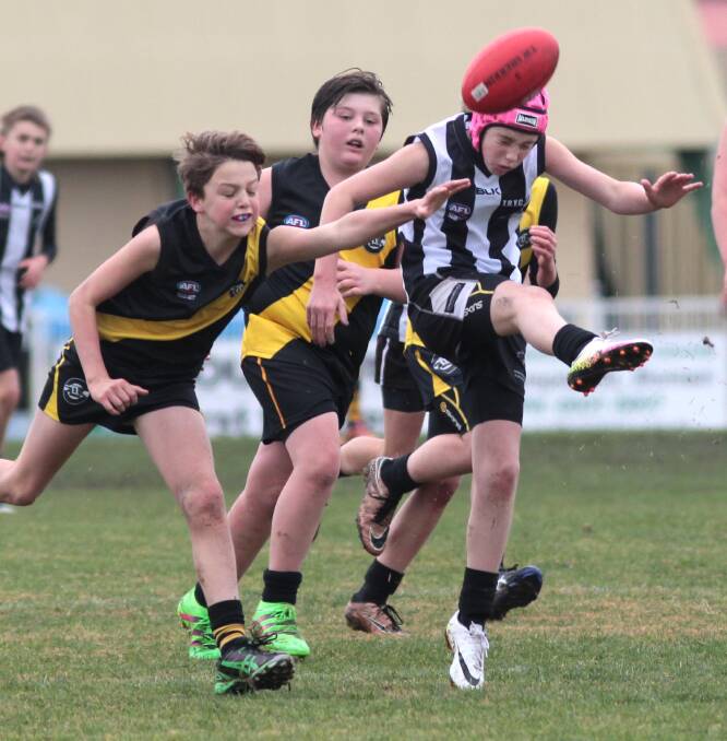 FOOTY: TRYC's Aston Limberger and Wagga Tigers' Joshua Prest clash during the under 12s junior AFL at Robertson Oval. Picture: Les Smith