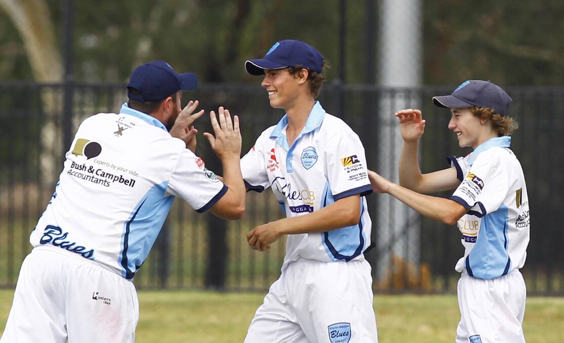 HAPPY: Blake Hartwell is congratulated by Ed Perryman and Joel Robinson during the St Michaels vs South Wagga cricket at Robertson Oval. Picture: Les Smith