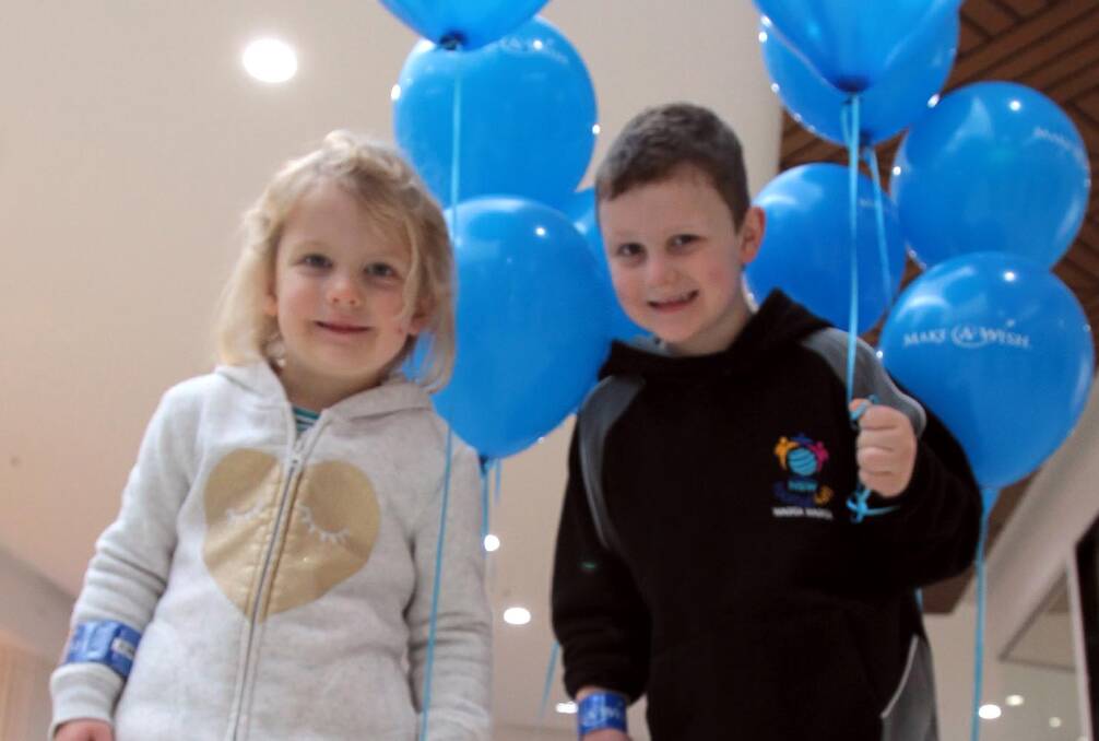 BABY BLUE: Eloise Bortolazzo, 3, with her brother Toby, 6, at the Make-A-Wish information stall at the Wagga Marketplace at the weekend. Picture: Les Smith
