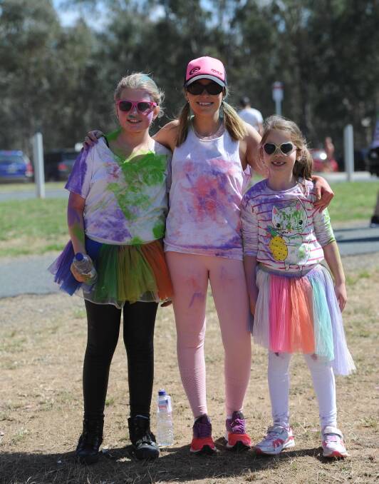 COLOUR BURST: Madison Post, Liz Meakin and Mia Phillips at the Lake Albert Public School colour run at the weekend. Picture: Laura Hardwick