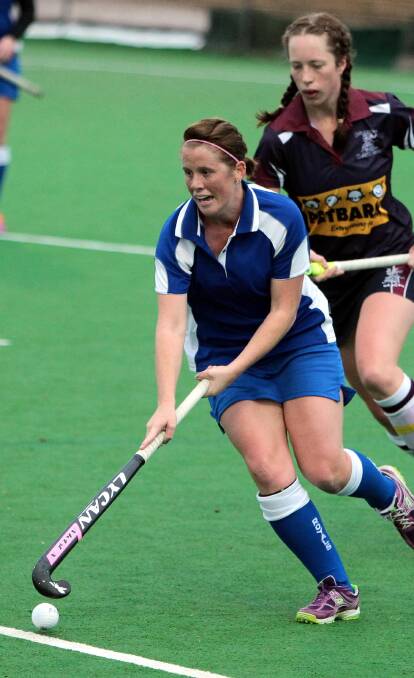 HOCKEY: Elise Kinsey from CSU and Simone Lotter from Royals during the weekend hockey match  at Jubilee. Picture: Les Smith