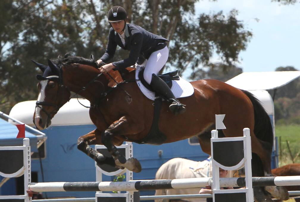 FUTURE STAR: Stephanie Fenn on Woodside Moonlord during the NSW Country Showjumping Championships at CSU Equine Centre at the weekend. Picture: Les Smith