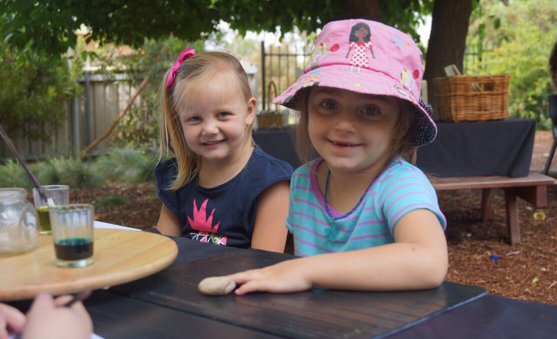 Fun time: Indi Hull, 4, and Sophie Kerslake, 4, were all smiles during their outdoor time at preschool. 