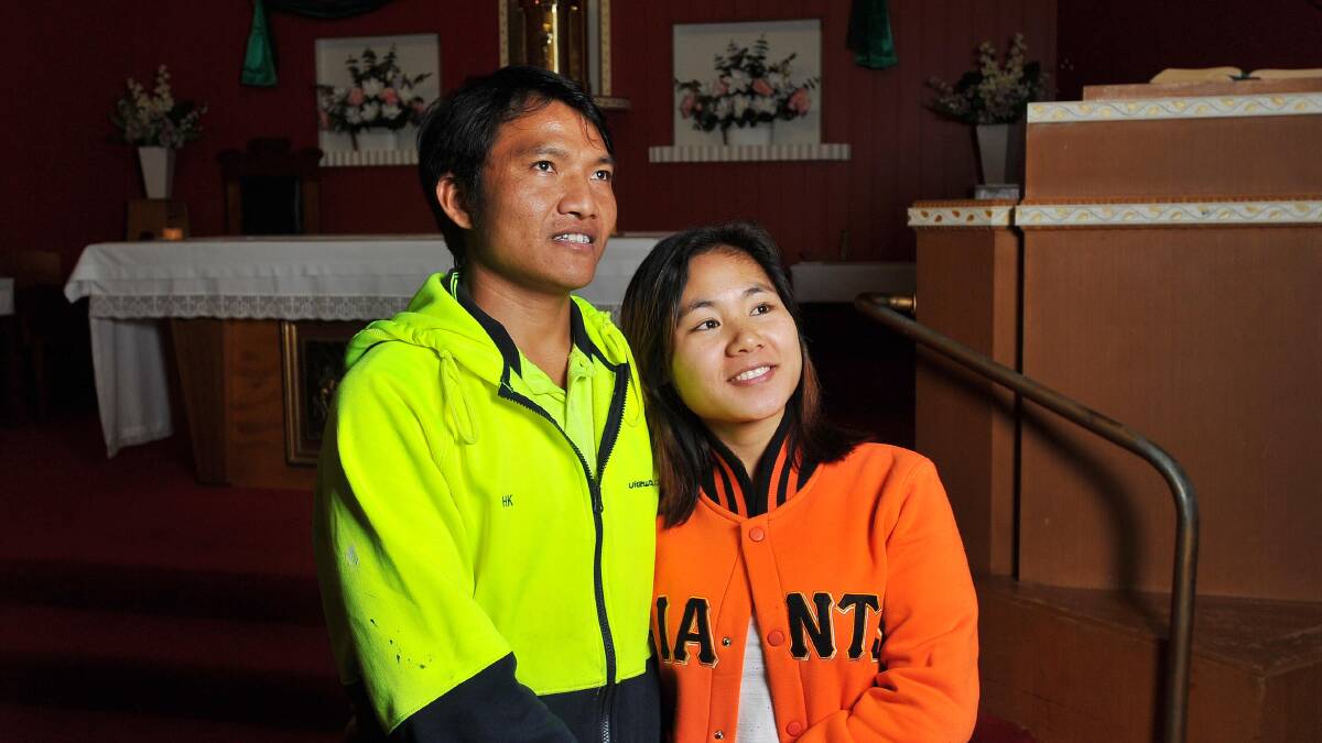 I DO: Hung Kee and Thang Shein in Our Lady of Fatima Catholic Church where they will be married again in their faith on Saturday. Picture: Kieren L Tilly