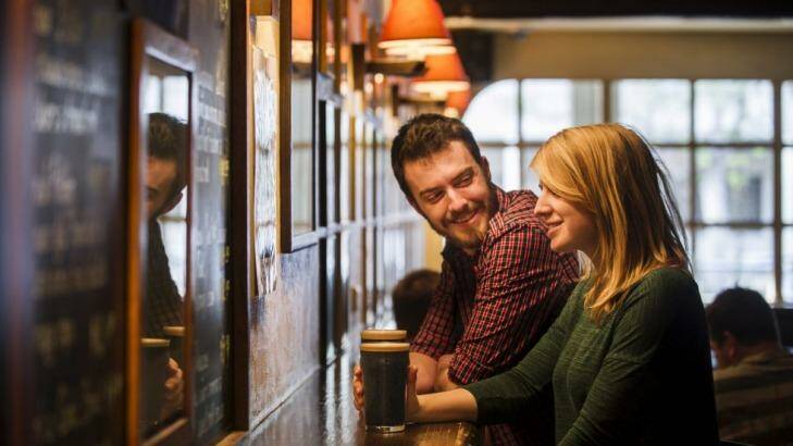 Good taste: Andrew  Deakins and Anna Trundle from Turner enjoy a stout at the Wig and Pen on Sunday. Photo: Rohan Thomson