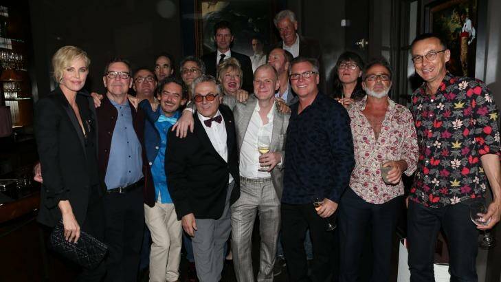 George Miller and Charlize Theron celebrate with others at a pre Oscar bash.  Photo: Karl Larsen/Coleman-Rayner