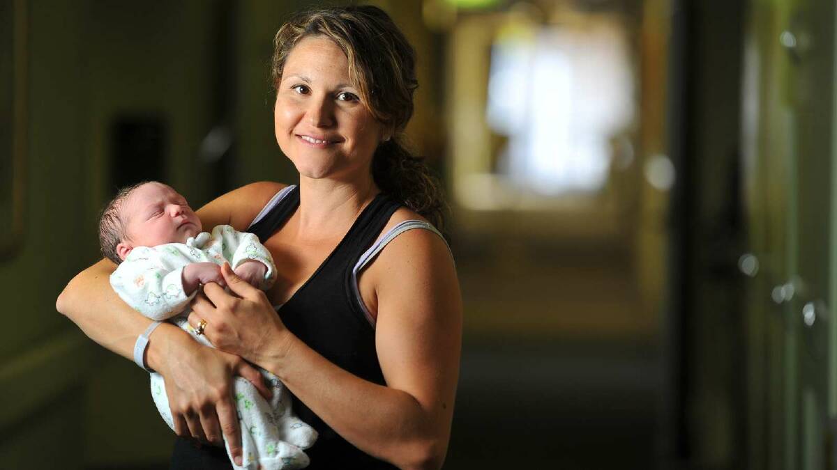 Marley Andreas Vidler was the first baby born in Wagga on January 1, 2013. Marley is held by mum Vanessa. Picture: Addison Hamilton