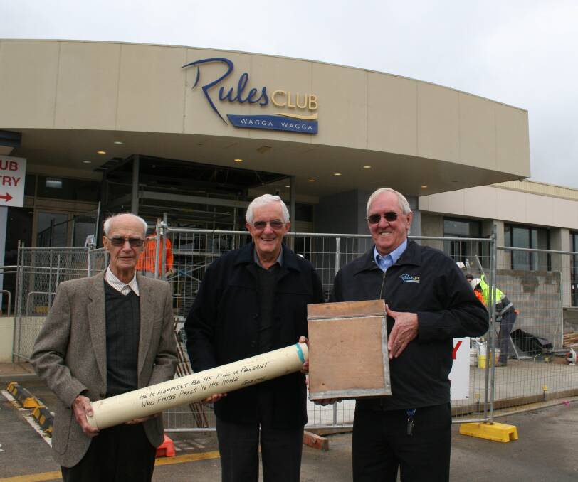 THE BIG DIG: Founding directors Max Sydenham and Peter Reid with Rules Club president Paul Sutton and the club's time capsules. Picture: Declan Rurenga
