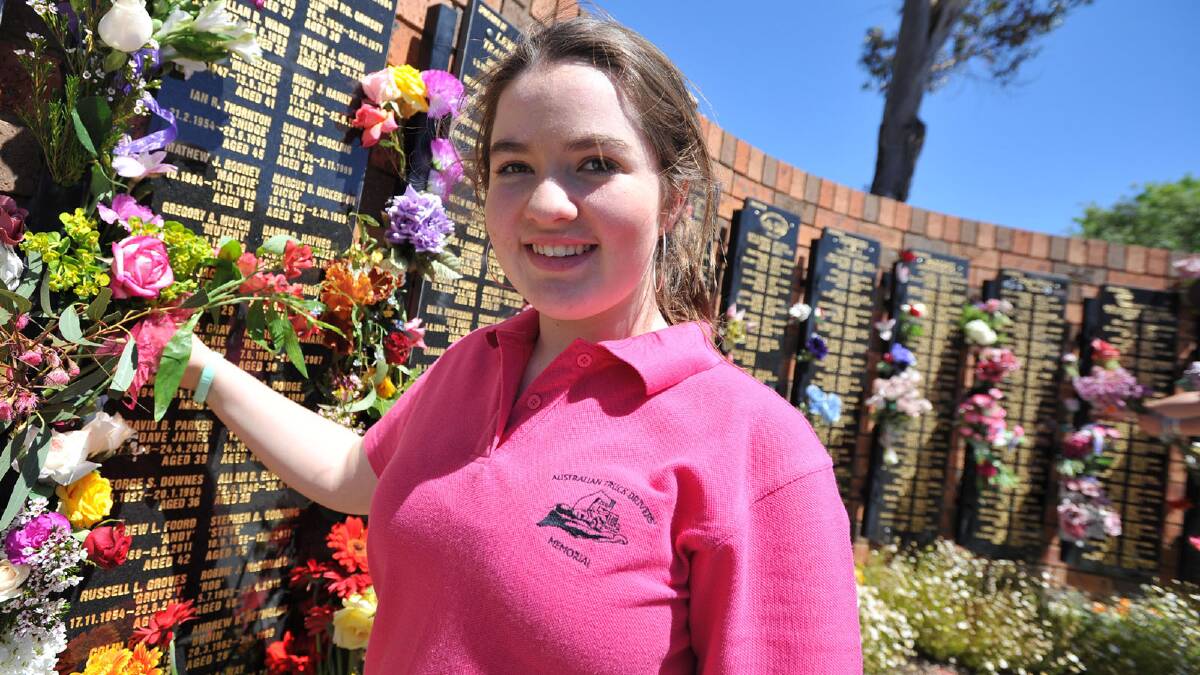 Australian Truck Driver's Memorial service ... Celina Mutch (13) of Hamilton Vic places flowers at the plaque for her father Gregory Mutch 'Mutchy'.  Picture: Michael Frogley