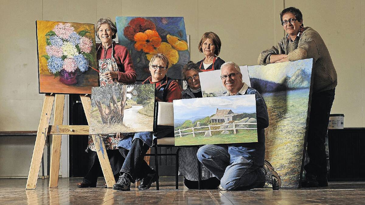 ARTISTIC FLAIR: Lakeside Art Group members (left) Margaret Beck, Bev and Pat Hill, Sally Mumford, David Ohlsen and Stuart Wallace display some of the art which will go on sale at Markets by the Lake. Picture: Oscar Colman