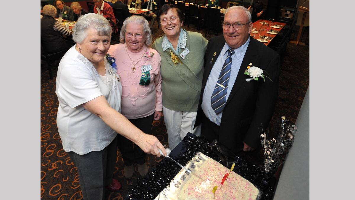 CELEBRATION: Founding member Marie O'Regan cuts the impressive cake at the RSL Day Club 30th anniversary last week in front of administrator Molly Schultz, deputy coordinator Marie O'Keefe and coordinator Ken Kingnator. Picture: Michael Frogley