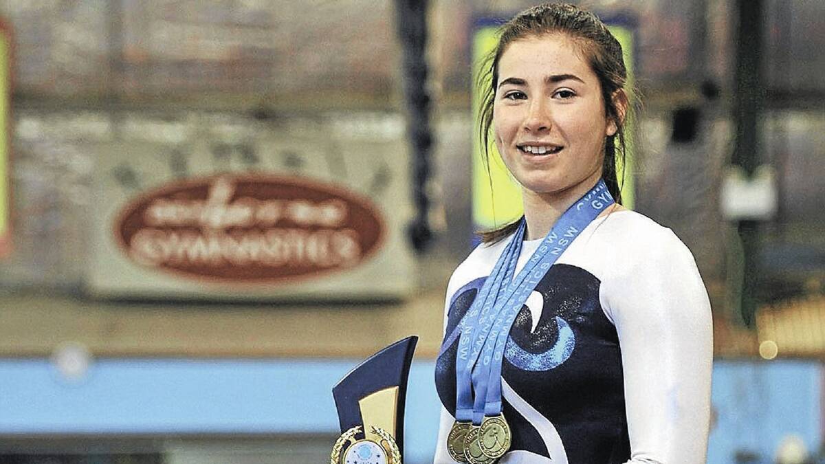 STELLAR ACHIEVEMENT: Madeleine Lucas shows off her State Championship medals and trophy.
