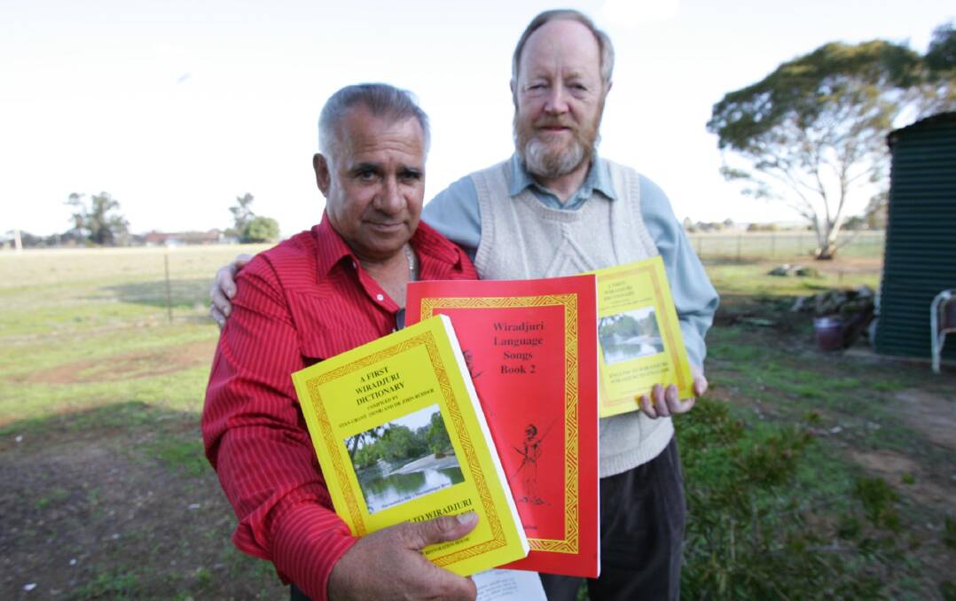 LANGUAGE PRESERVED: Co-authors Doctor Stan Grant Senior and Dr John Rudder launch the Wiradjuri dictionary and language materials.