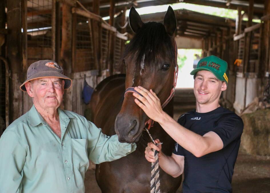 Peter Clancy and current stable apprentice Caine Stuart with The Clan at Sona Lodge. Picture by Kim Woods