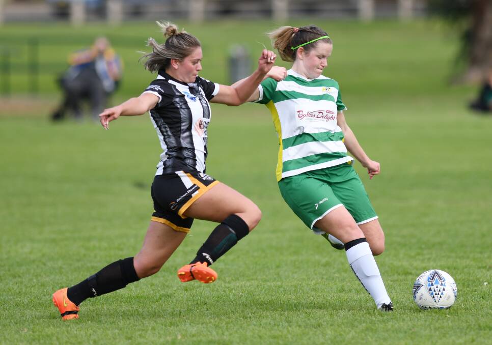GIRL POWER: Manessah Humphries and Rhiannon Daisley battle for possession during the women's Wanderers v Tuggeranong United at Rawlings Park at the weekend. 