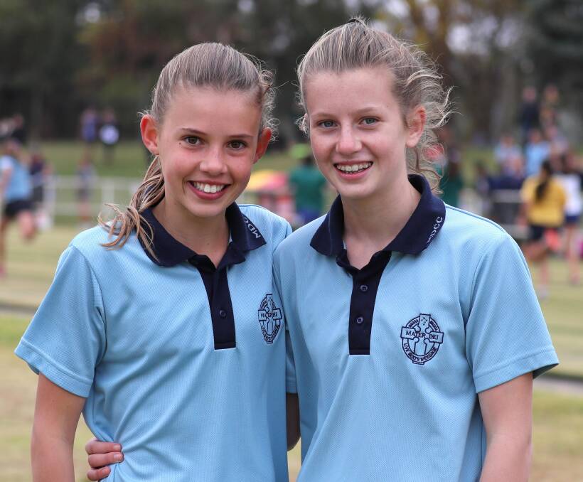 ATHLETES: Mater Dei Catholic College athletes Ruby Doherty, 12, and Cleo Buttifant, 13, at the Combined Wagga High Schools athletics carnival at Jubilee Park. Picture: Les Smith