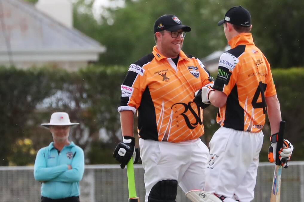 PAT ON THE BACK: RSL's Todd Henderson and Tim Cameron celebrate during the Twenty20 Wagga Cricket match against St Michaels on Saturday. Picture: Emma Hillier