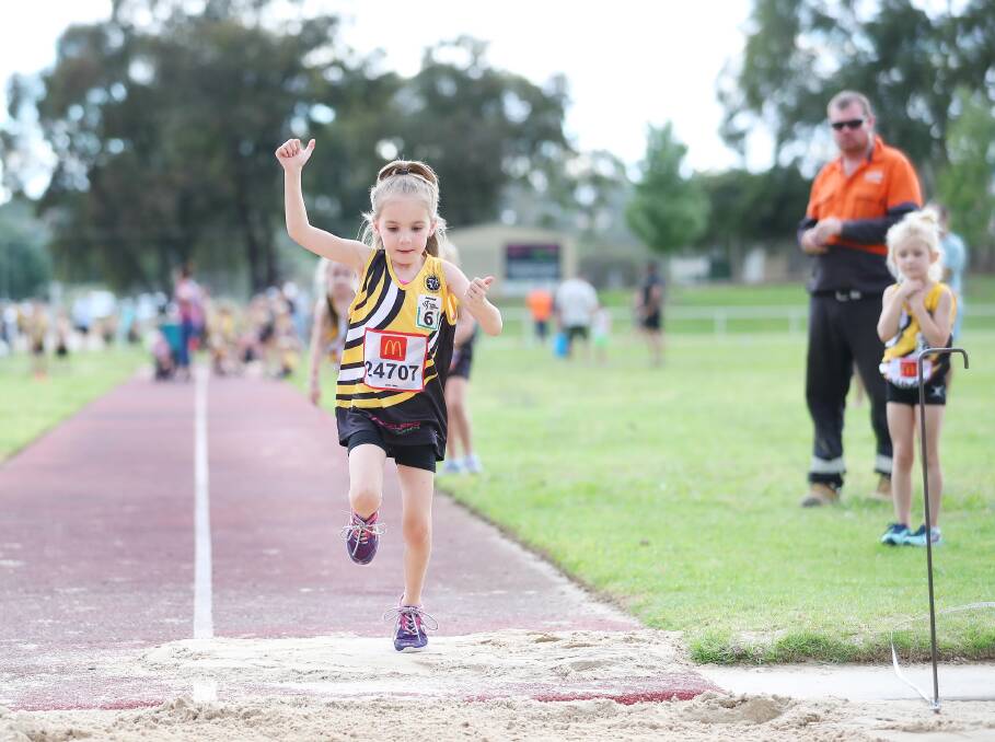 LONG JUMP: Bayli King, 5, of Wagga, at the Wagga Athletics Club night at Jubilee Park last week. Picture: Kieren L Tilly