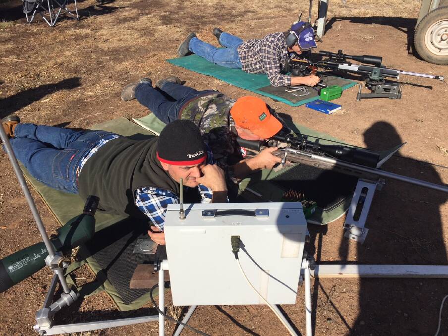 SHOOT: Dave Xuereb coaches Wayne Grentell and Chris Veness during the Explorers Rifle Club shoot at the weekend. Picture: Contributed