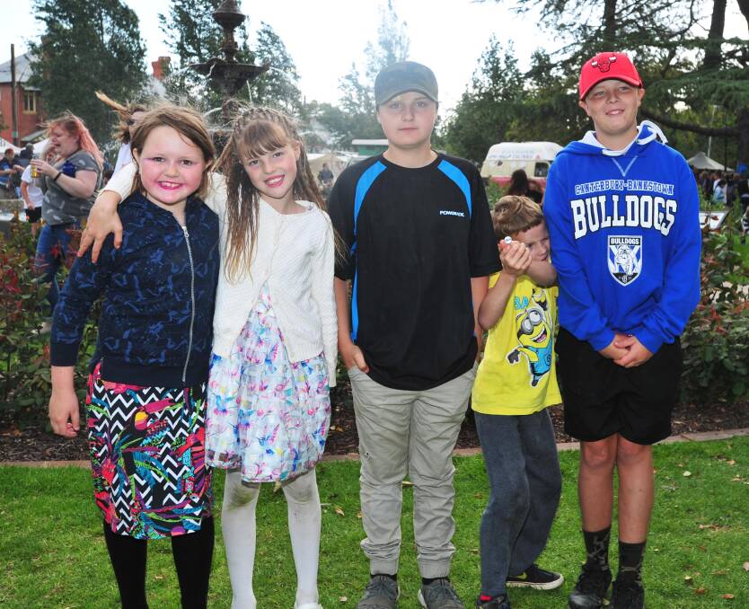 FRIENDS: Sasha Pascoe, 9, with the Harrisons - Natalie, 9, Kaden, 13, Michael, 8 and Shauwn, 15 at the Fusion Festival on Saturday in the Victory Memorial Gardens. Picture: Chelsea Sutton