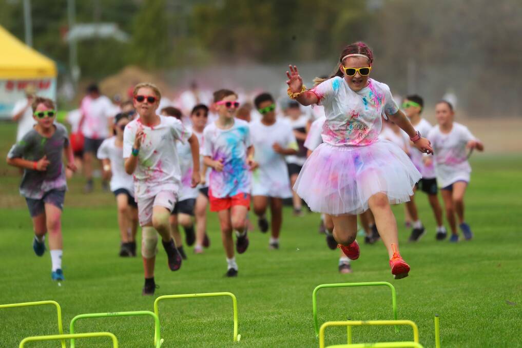 BRIGHT: Shyla Passlow leads the charge during the Henschke Primary School Colour Run at the weekend. Picture: Emma Hillier
