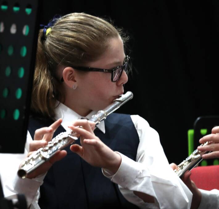 MUSIC: Ruby McRae, 12, plays flute with Henschke Primary School during the 98th Wagga Eisteddfod school instrumental performances at Joyes Hall. Picture: Les Smith