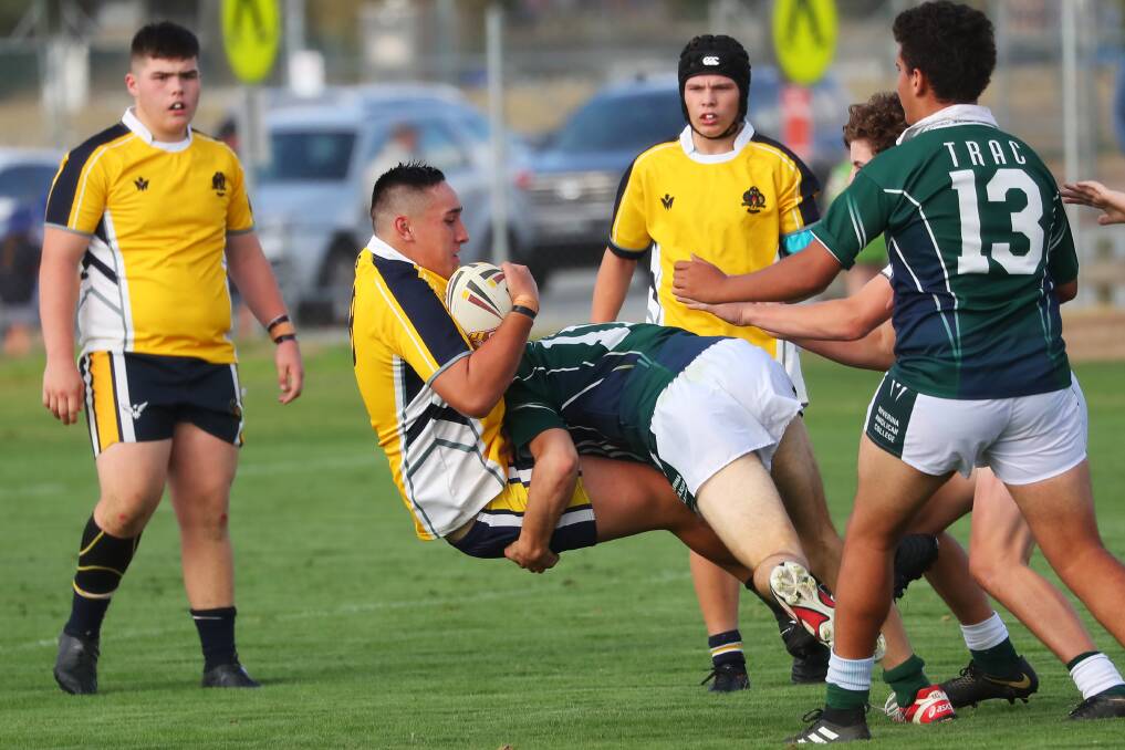 HARD HIT: Riley Norton-Fraser in action during the Hardy Shield clash between The Riverina Anglican College (TRAC) v Kooringal High School. Picture: Emma Hillier