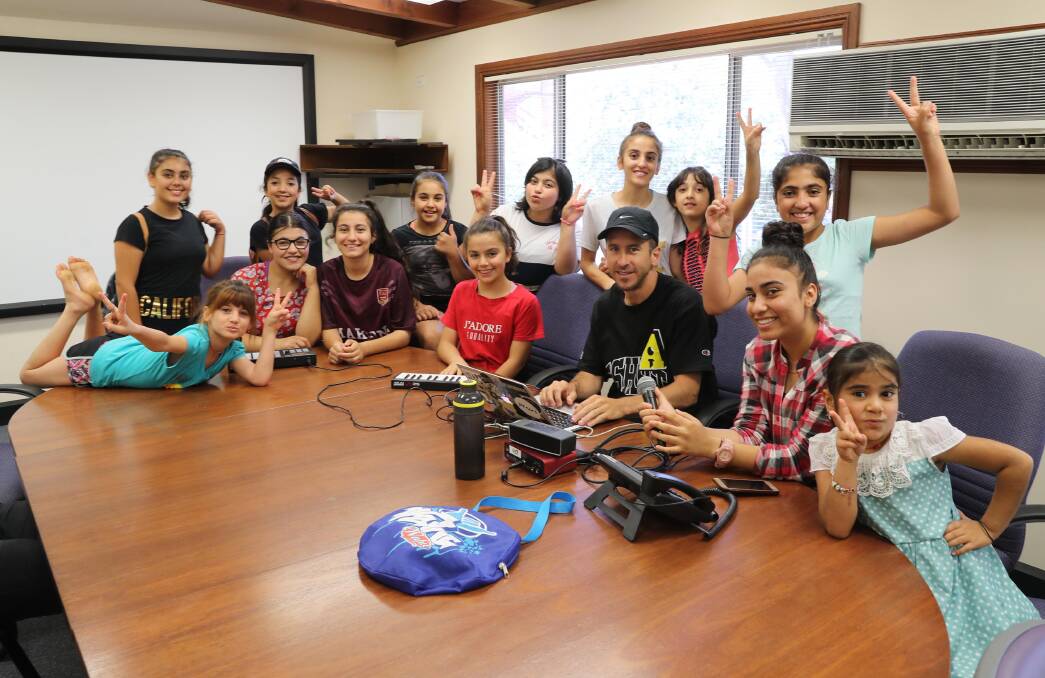 MAKING MUSIC: Kids get creative at the Multicultural Council last week for the school holidays, with music recording and production and visual media workshops. Picture: Les Smith