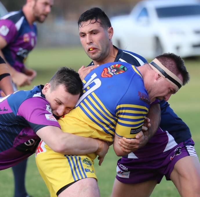 TOUGH STUFF: Joshua Cochrane, Nathan Rose and Patrick Guthrie do battle during the Junee and Southcity Group 9 clash at Junee. Picture: Les Smith