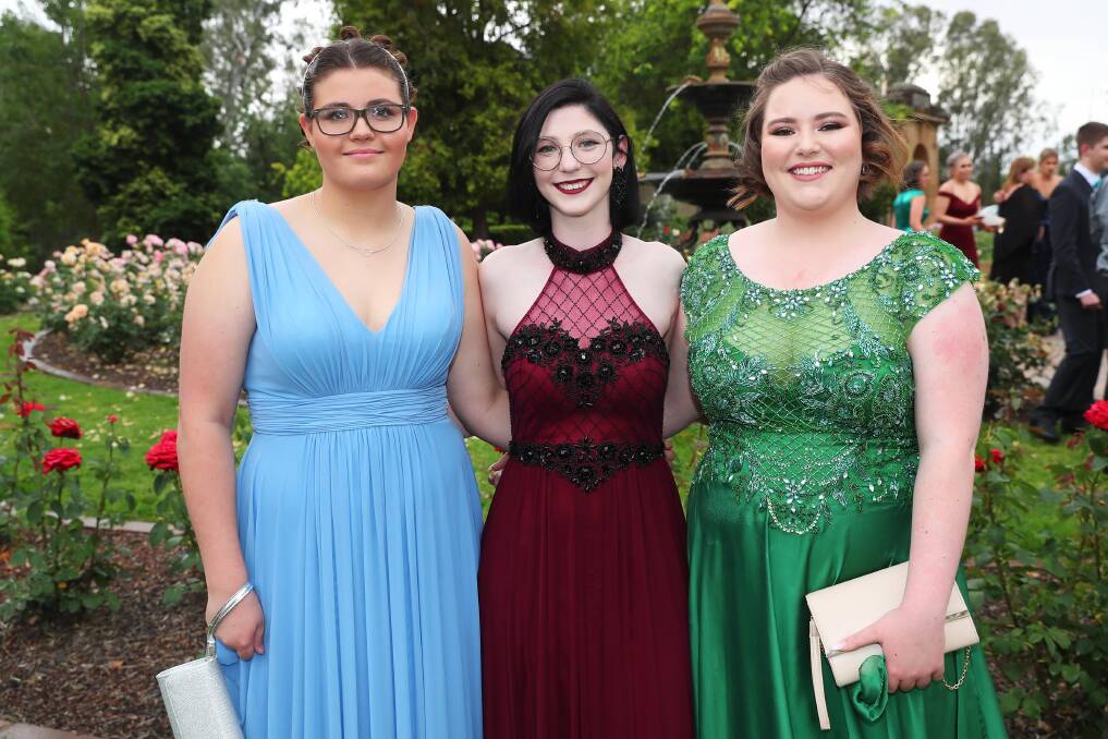 FORMAL FUN: Rebekah Cain, Jessica Robbie and Morgan Reynolds, are ready to celebrate at their Kooringal High School year 12 formal last week. Picture: Emma Hillier