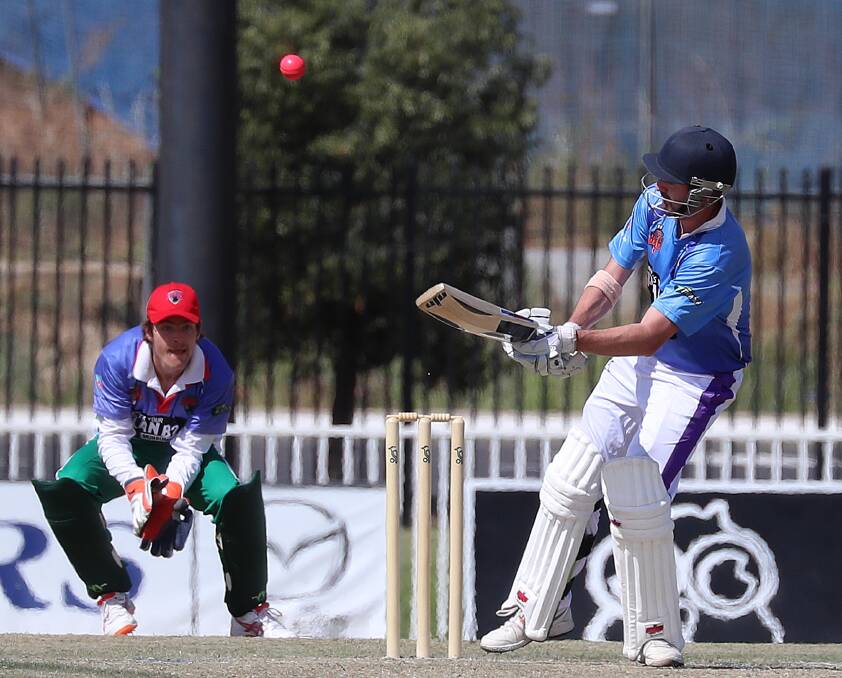 SLOGGER: Alex Smeeth and keeper Tim McGufficke during Murrumbidgee Rangers and Wagga Sloggers' Twenty20 Regional Bash at Robertson Oval. Picture: Les Smith