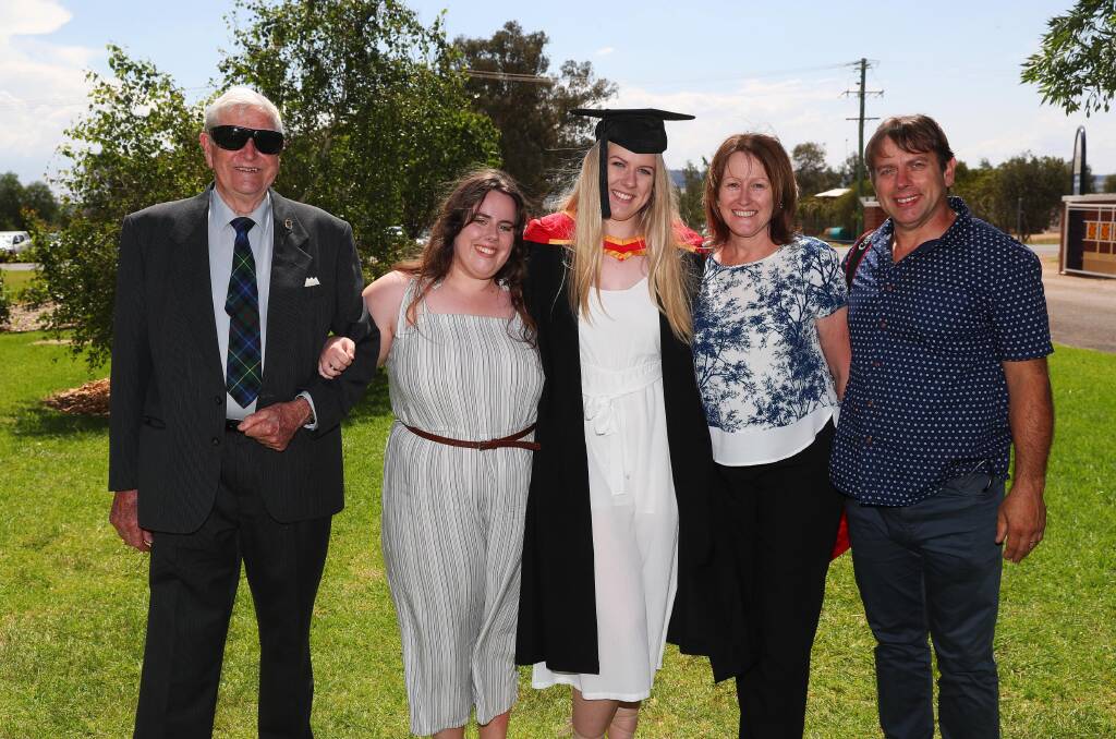 DONE: Neville Smith celebrates with Lauren, Abbey, Joanne and Wayne Medlin the Faculty of Science graduation at Charles Sturt University last week. Picture: Emma Hillier