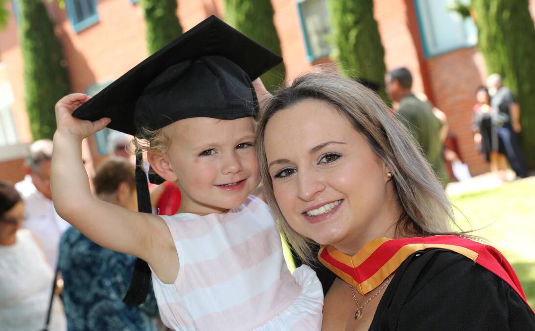 MILESTONE MOMENT: Jess Robinson from Coolamon with daughter Amity, 2, after graduating with a Bachelor of Nursing at Charles Sturt University last week. Picture: Les Smith