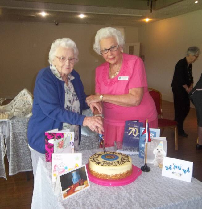 MILESTONE: Von Post and Shirley Bergemier, the longest-serving CWA The Rock branch members, cut the cake at The Rocks’ 70th birthday afternoon tea.