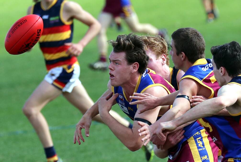 SEMI-FINAL: Jack McCaig is in the thick of it during the Riverina League first semi-final at Narrandera between GGGM and Leeton-Whitton at the weekend. Picture: Les Smith