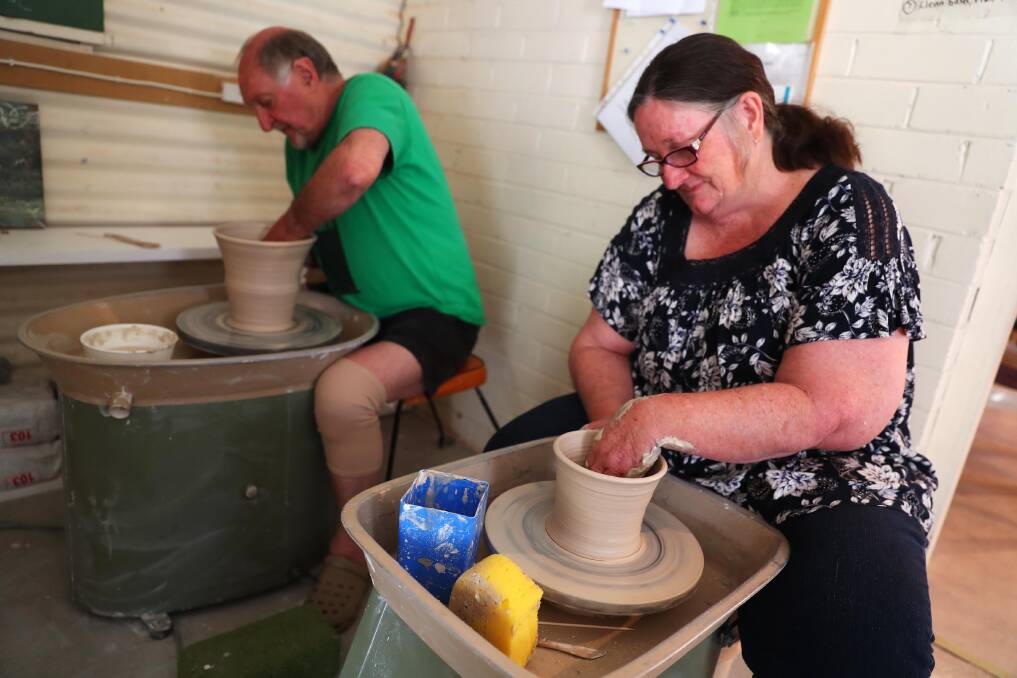AT WORK: Brian Barkworth and Linda Lander are hoping more residents will explore the world of pottery and sign up to the club. Both are eager to pass on the skills they have. Picture: Emma Hillier 