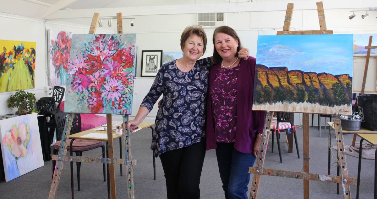 LOCAL ARTISTS: Bev Harris and Jenny Nixon encourage the community to continue supporting their work and to check out their gallery in Small Street. Picture: Annie Lewis 