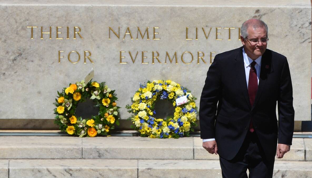 Scott Morrison at a Remembrance Day service last year. There is a self-imposed agreement by the major parties not to campaign on Good Friday, Easter Sunday and Anzac Day. Photo: AAP