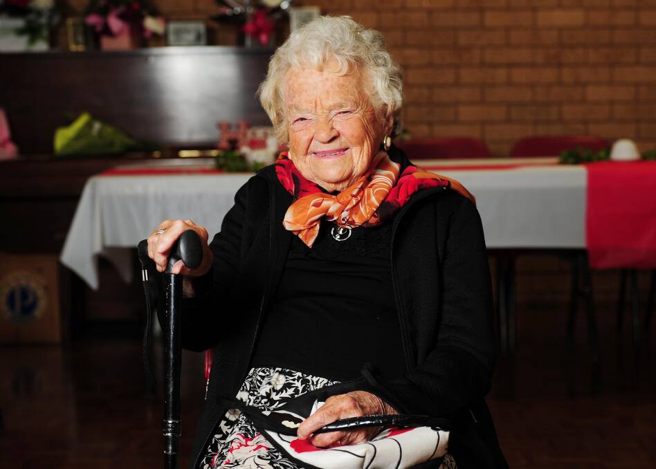 ALL SMILES: Thersa Hillier reflects on 100 years of memories at her birthday party on Saturday, celebrating the great day with her many, many descendants. Picture: Kieren L. Tilly 