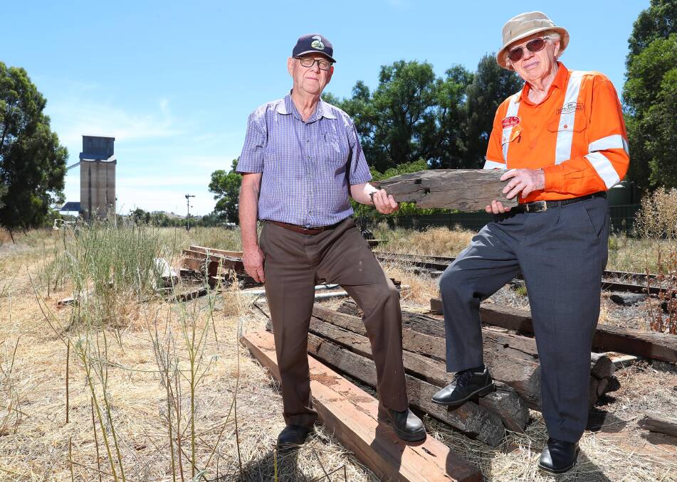 DEVASTATED: Wally Bell, treasurer of Ladysmith Tourist Railway and chairman Richard Goodman at the scene of the crime. Around 130 sleepers were stolen from beside the track last week. Picture: Kieren L Tilly 

